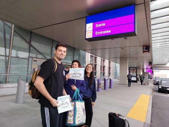 Happy Lets Fly Travel customer receiving a free airport drop