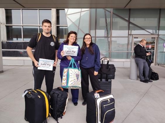 Happy Lets Fly Travel customer receiving a free airport drop
