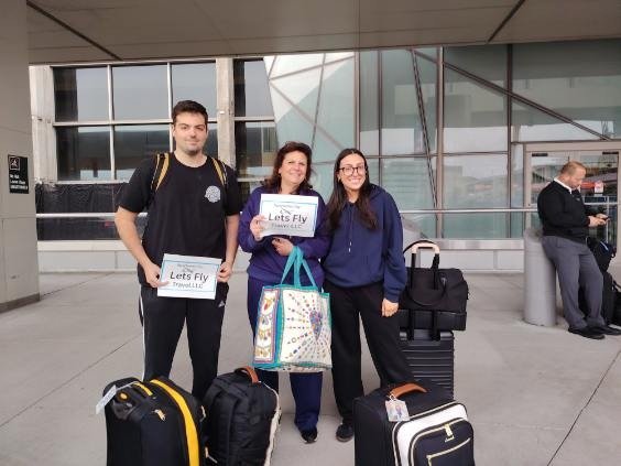 Happy Lets Fly Travel customer receiving a free airport drop