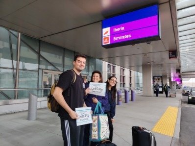 Happy Lets Fly Travel customer receiving a free airport drop