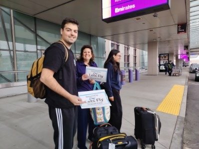 Happy Lets Fly Travel customer receiving a free airport drop